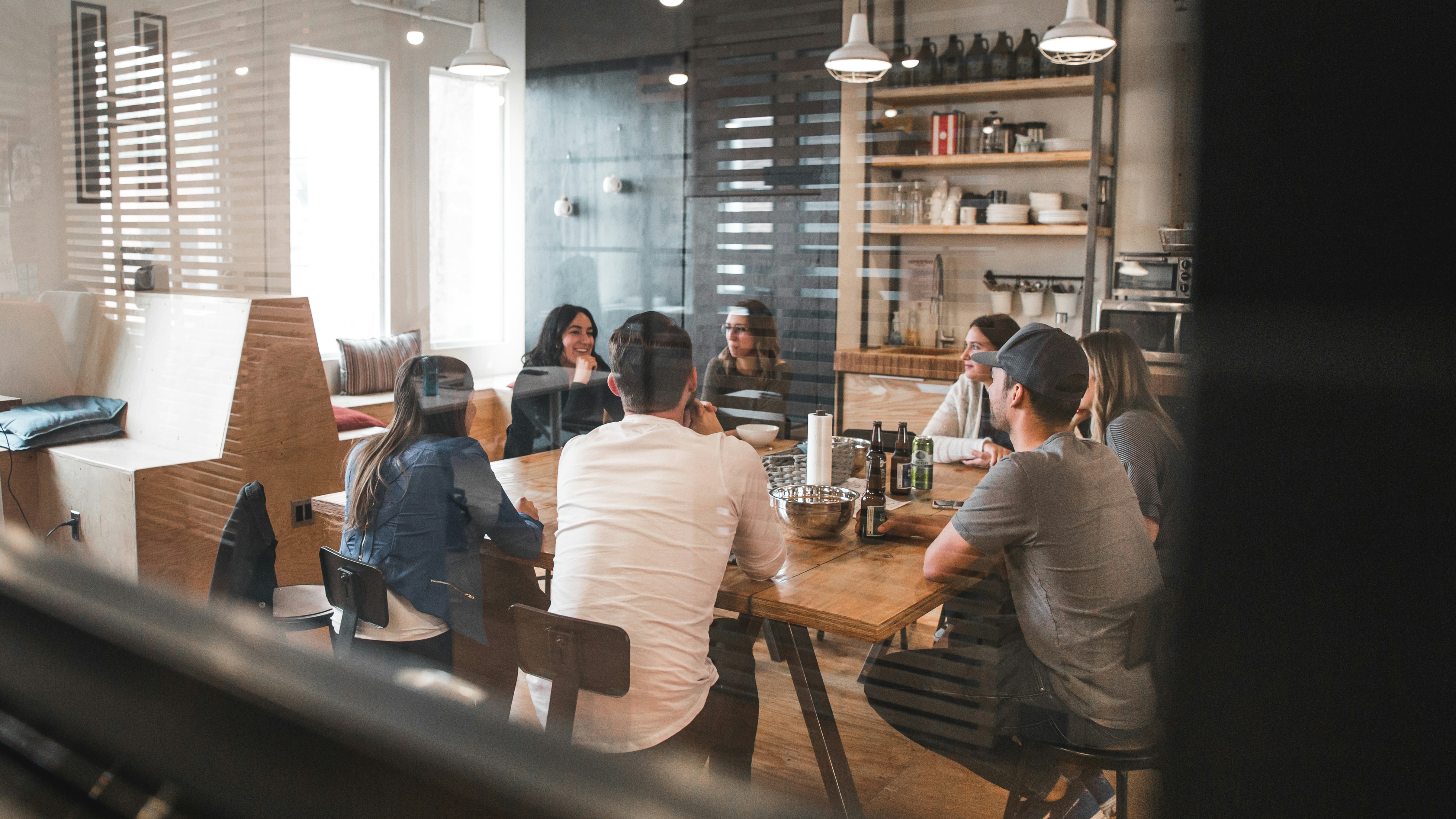 Agency team reviewing LinkedIn outreach performance data together across multiple client accounts